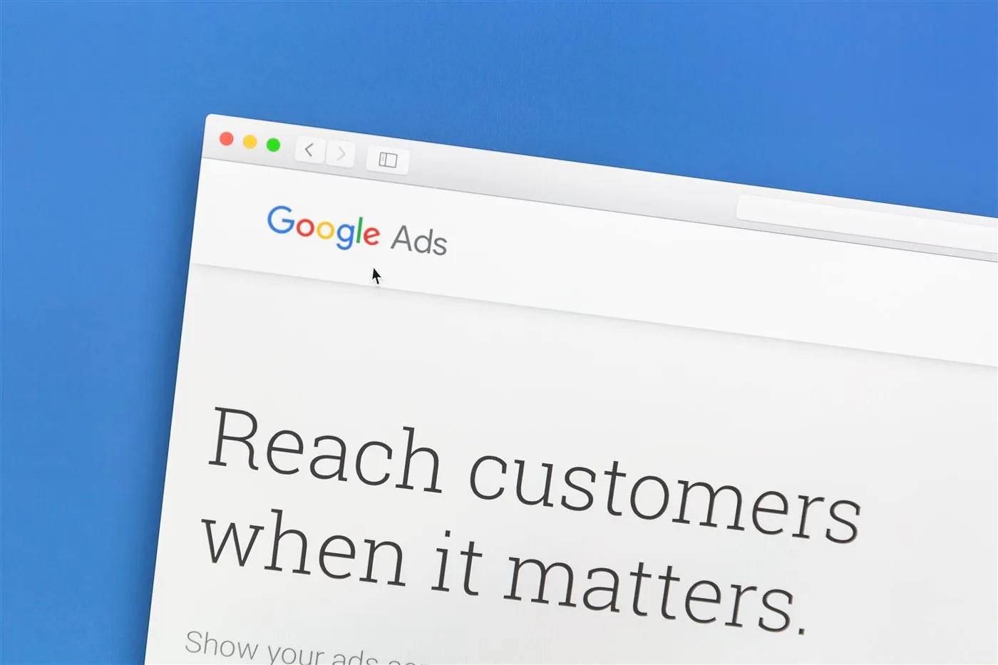 The Google Ads homepage on a desktop monitor